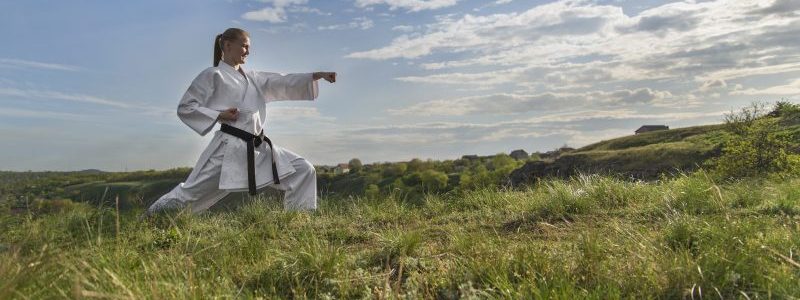 black belt woman outside