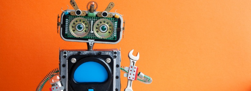 toy robot with a wrench | technology tools for remote team productivity